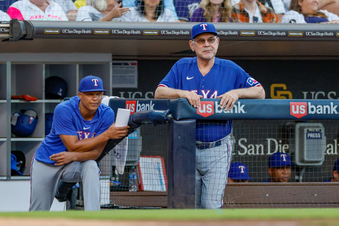 Jul 29, 2023; San Diego, California, USA; Texas Rangers manager Bruce Bochy (15) and associate manager Will Venable (83) watch on as San Diego Padres starting pitcher Yu Darvish (11) pitches during the fifth inning against the San Diego Padres at Petco Park. Mandatory Credit: David Frerker-USA TODAY Sports